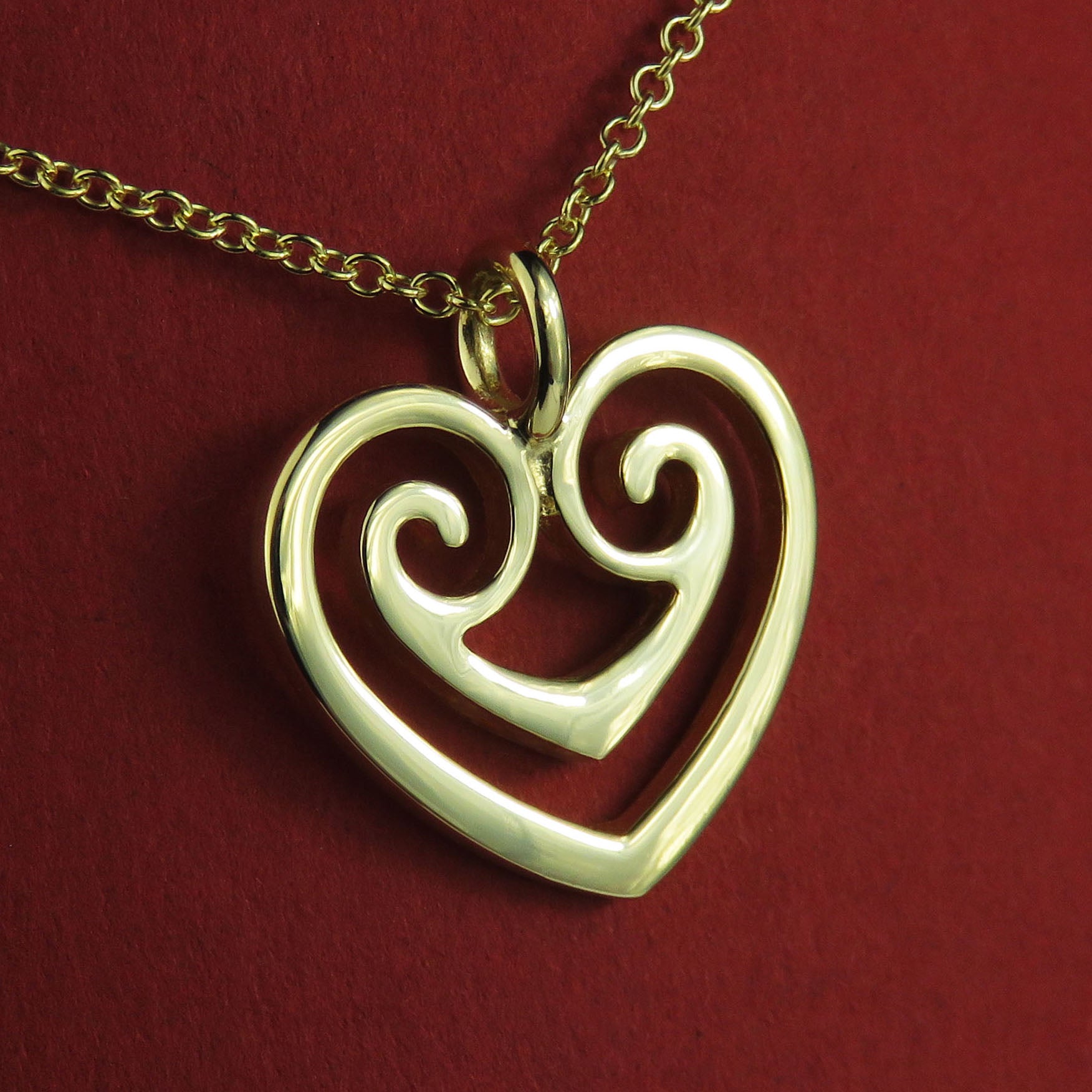 Two Hearts as One gold pendant necklace