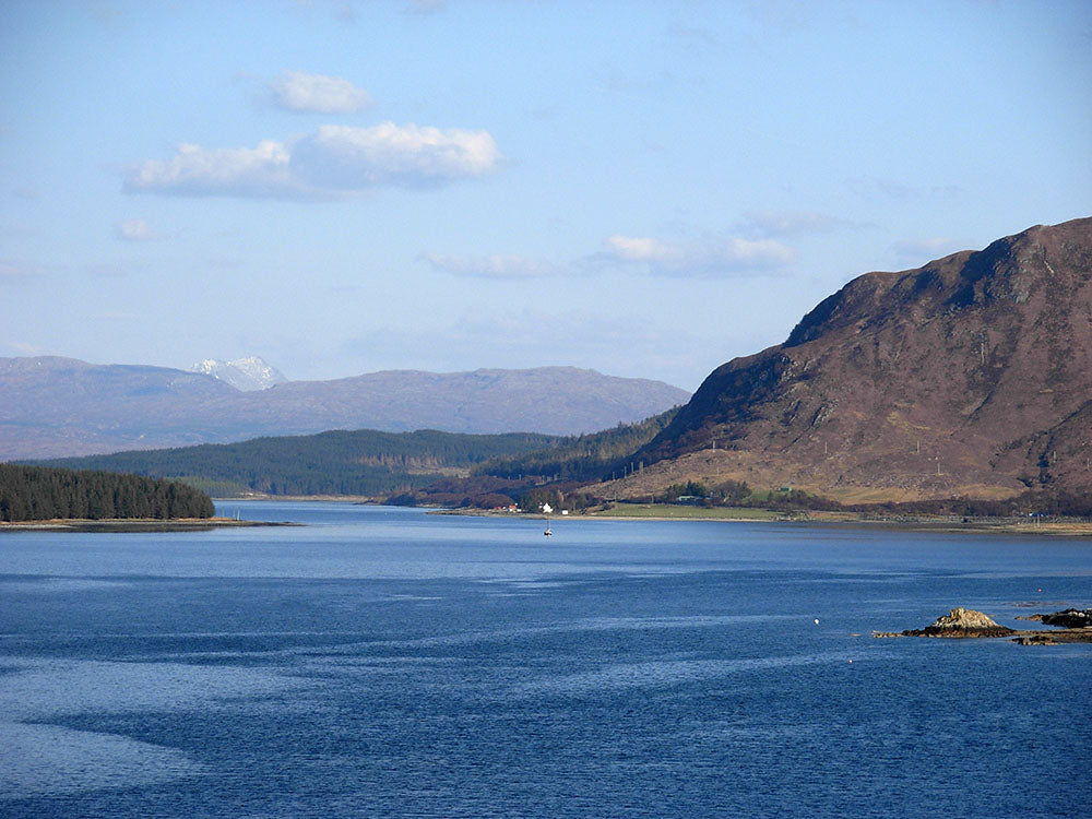 Sea loch with hills in background
