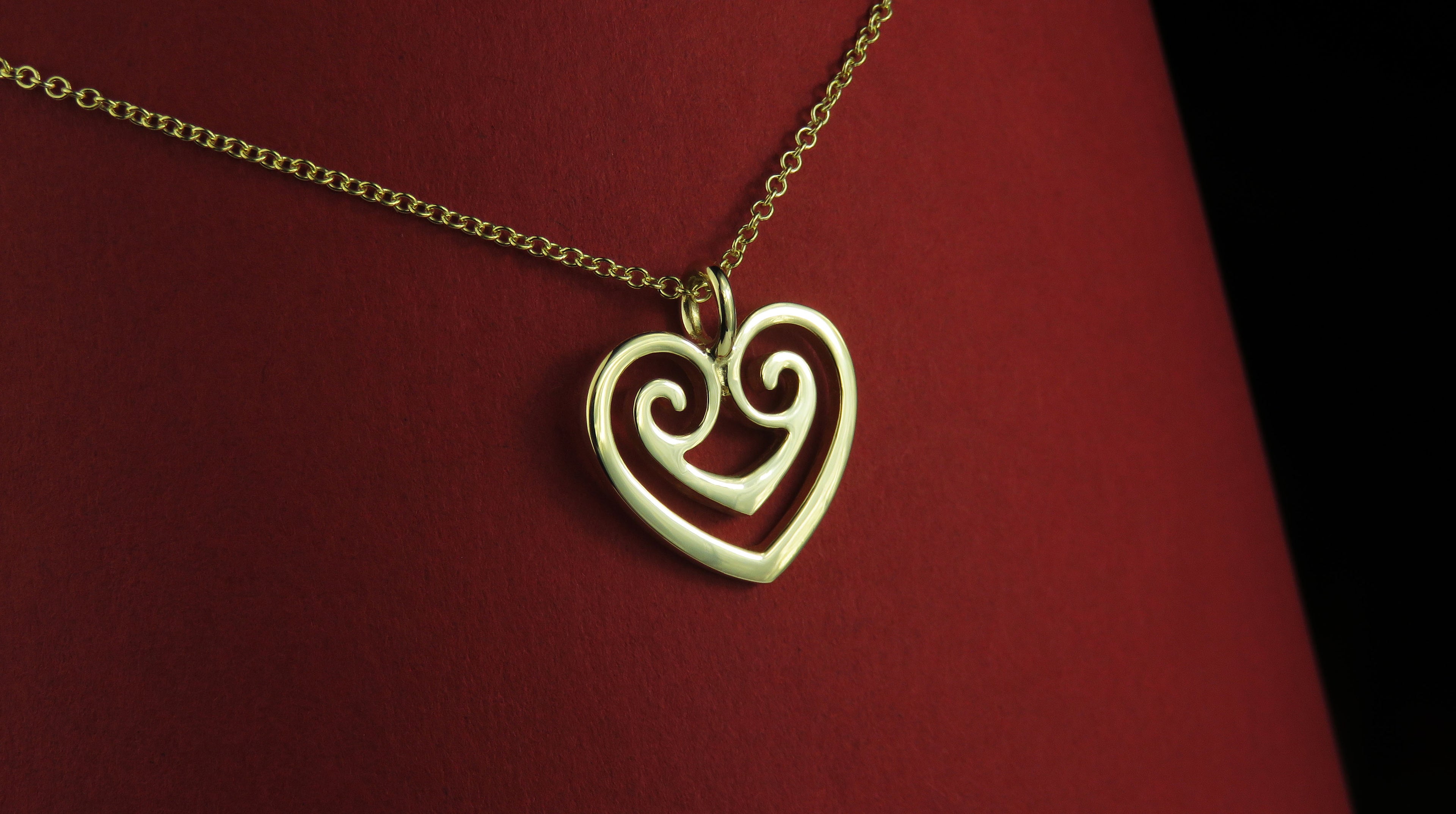 Two hearts gold pendant necklace